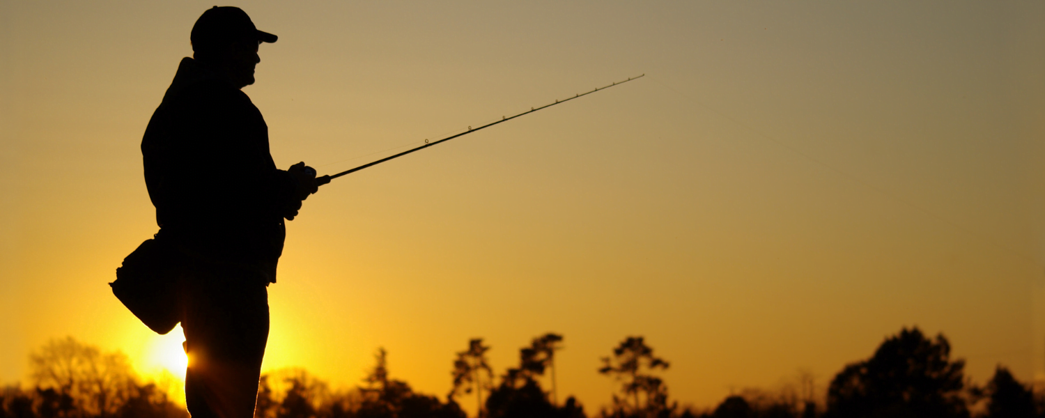 Man fishing at sunset