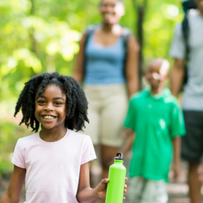 family hiking in woods