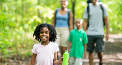 family hiking in woods