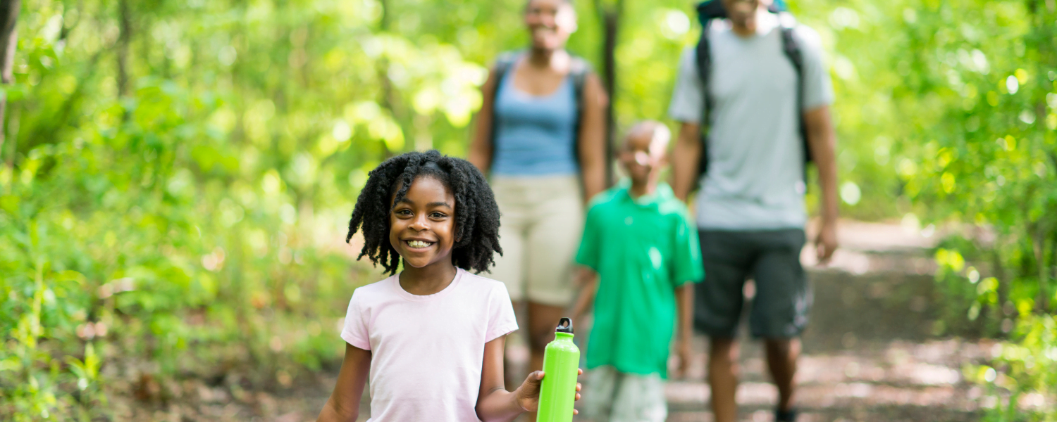 family hiking in woods