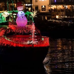 boat decorated with lights for a christmas boat parade