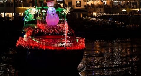 boat decorated with lights for a christmas boat parade