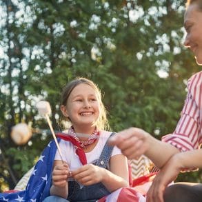 Family Bonfire Night with the American Flag and Marshmallows