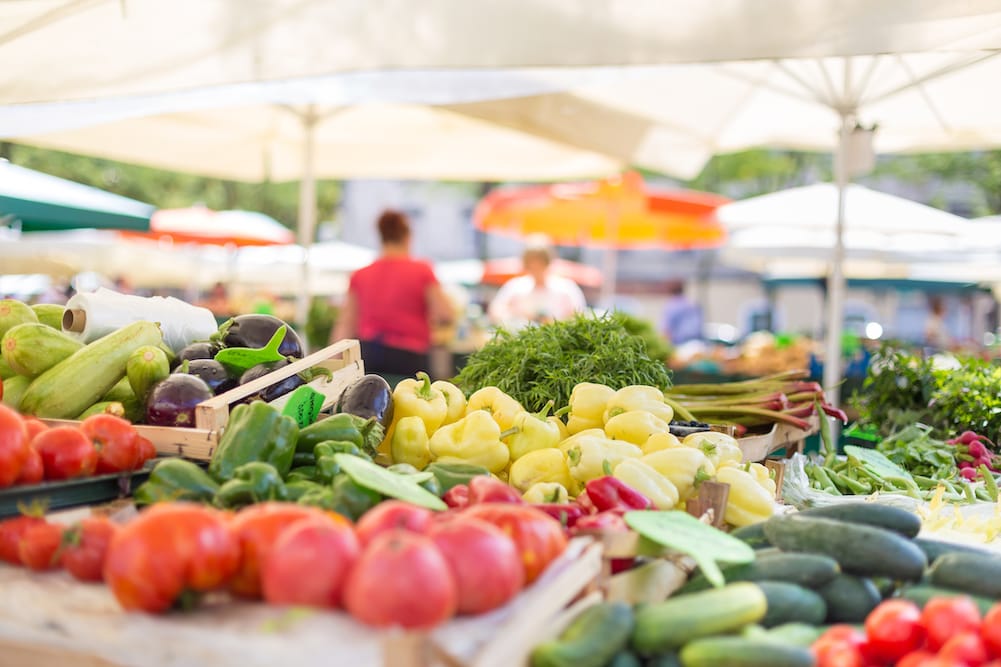 fresh produce displayed at a local farmers market stand. 