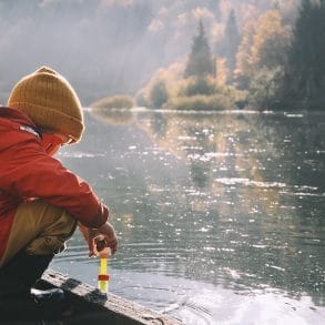kids by lake in winter coats